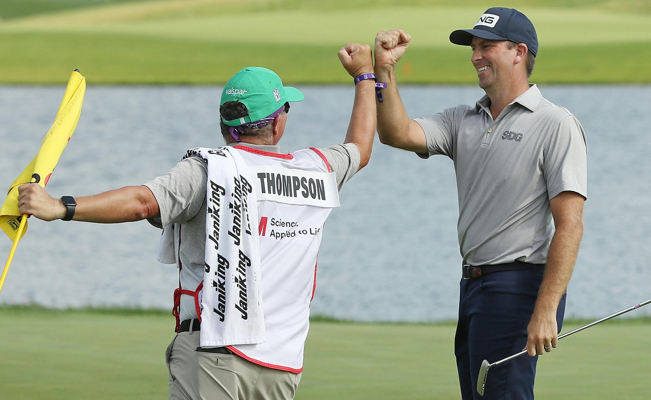 BLAINE, MINNESOTA - JULY 26: Michael Thompson of the United States celebrates with his caddie, Damian Lopez, on the 18th green after winning the 3M Open on July 26, 2020 at TPC Twin Cities in Blaine, Minnesota. (Photo by Matthew Stockman/Getty Images) ORG XMIT: 775478256