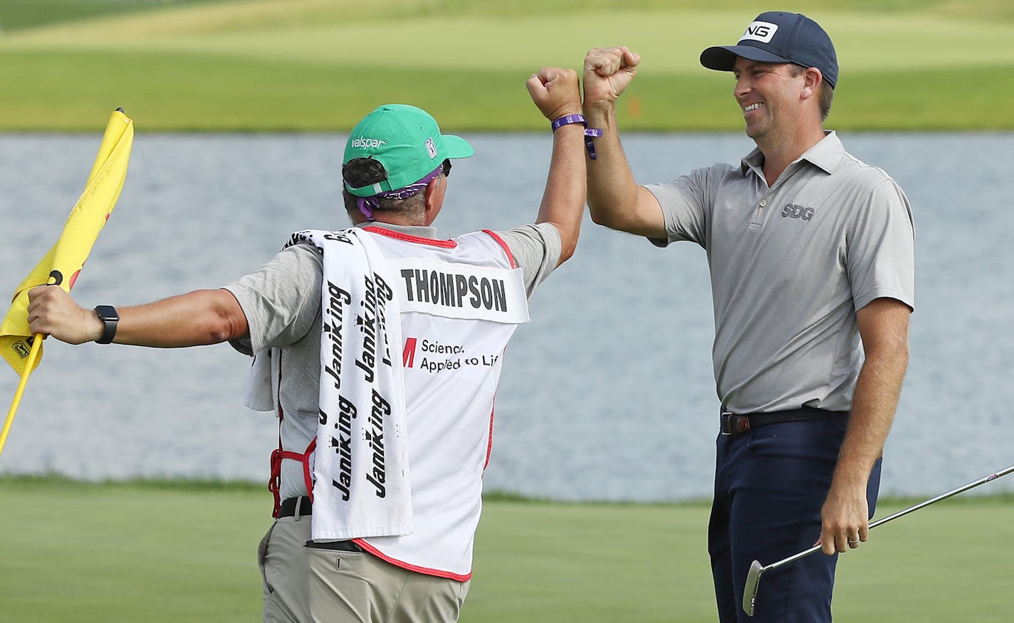 BLAINE, MINNESOTA - JULY 26: Michael Thompson of the United States celebrates with his caddie, Damian Lopez, on the 18th green after winning the 3M Open on July 26, 2020 at TPC Twin Cities in Blaine, Minnesota. (Photo by Matthew Stockman/Getty Images) ORG XMIT: 775478256