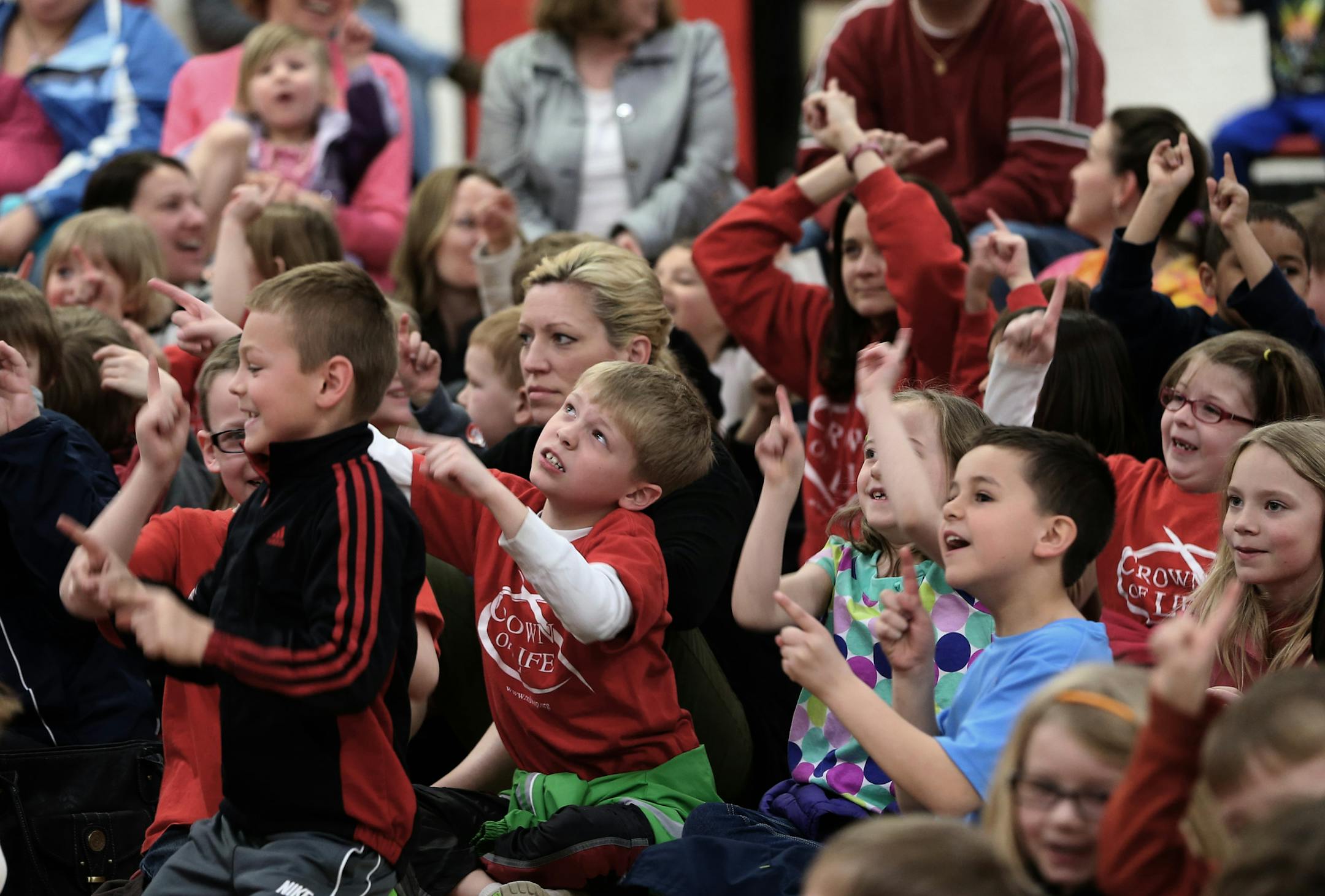 Kids sang along with the Okee Dokee Brothers, Justin Lansing and Joe Mailander during a show at the St. Croix Lutheran School, on 4/11/14. Several hundred twin cities children from pre-school to grade 4 attended the concert by the Grammy winning kids-music stars the Okee Dokee Brothers.] Bruce Bisping/Star Tribune bbisping@startribune.com Justin Lansing, Joe Mailander/source.