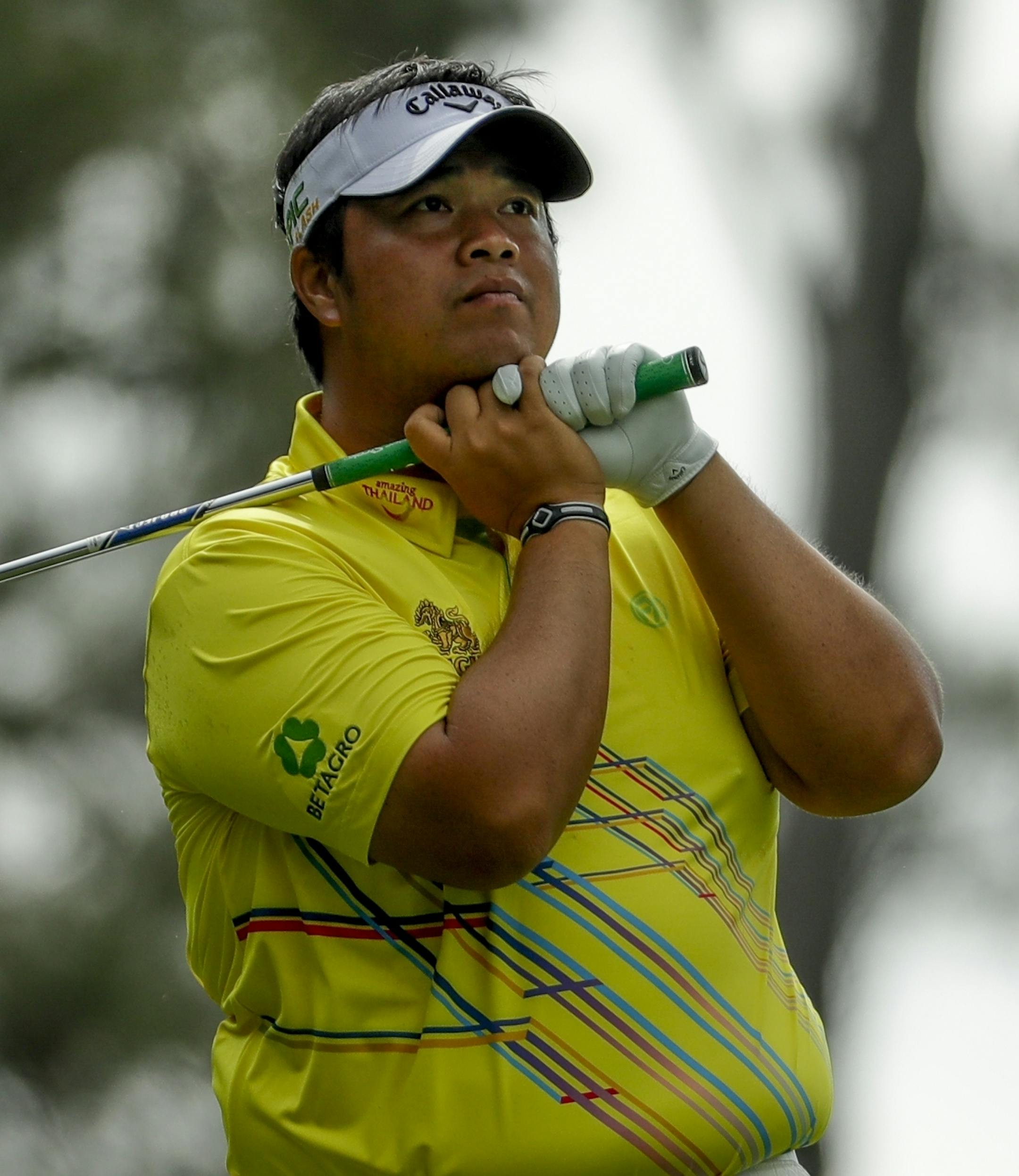 Kiradech Aphibarnrat, of Thailand, watches his shot on the fourth hole during the second round for the Masters golf tournament Friday, April 12, 2019, in Augusta, Ga. (AP Photo/Chris Carlson)
