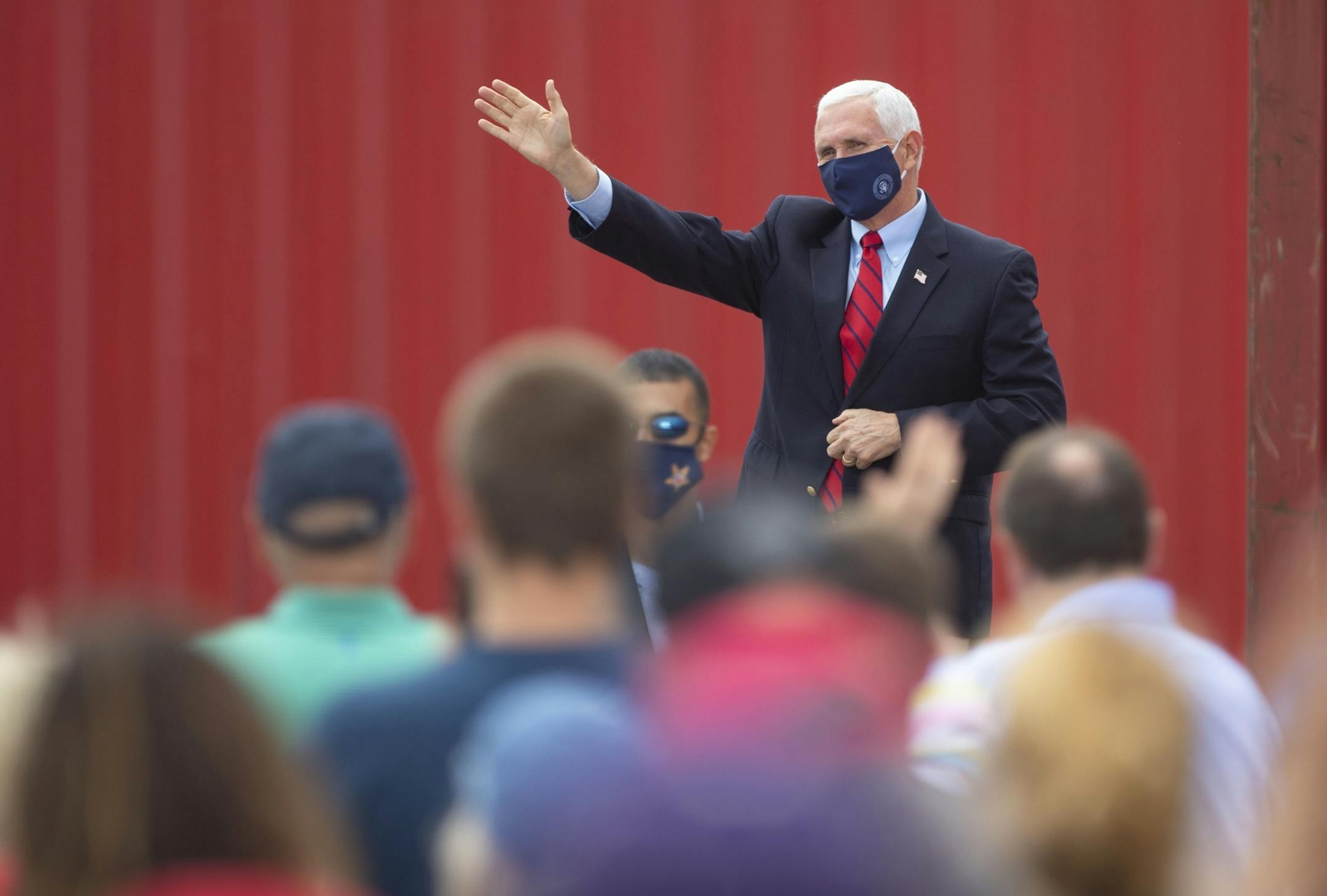 Vice President Mike Pence waved hello to a crowd of several hundred Republican supporters in Duluth outside Lake Superior Warehousing on Friday.