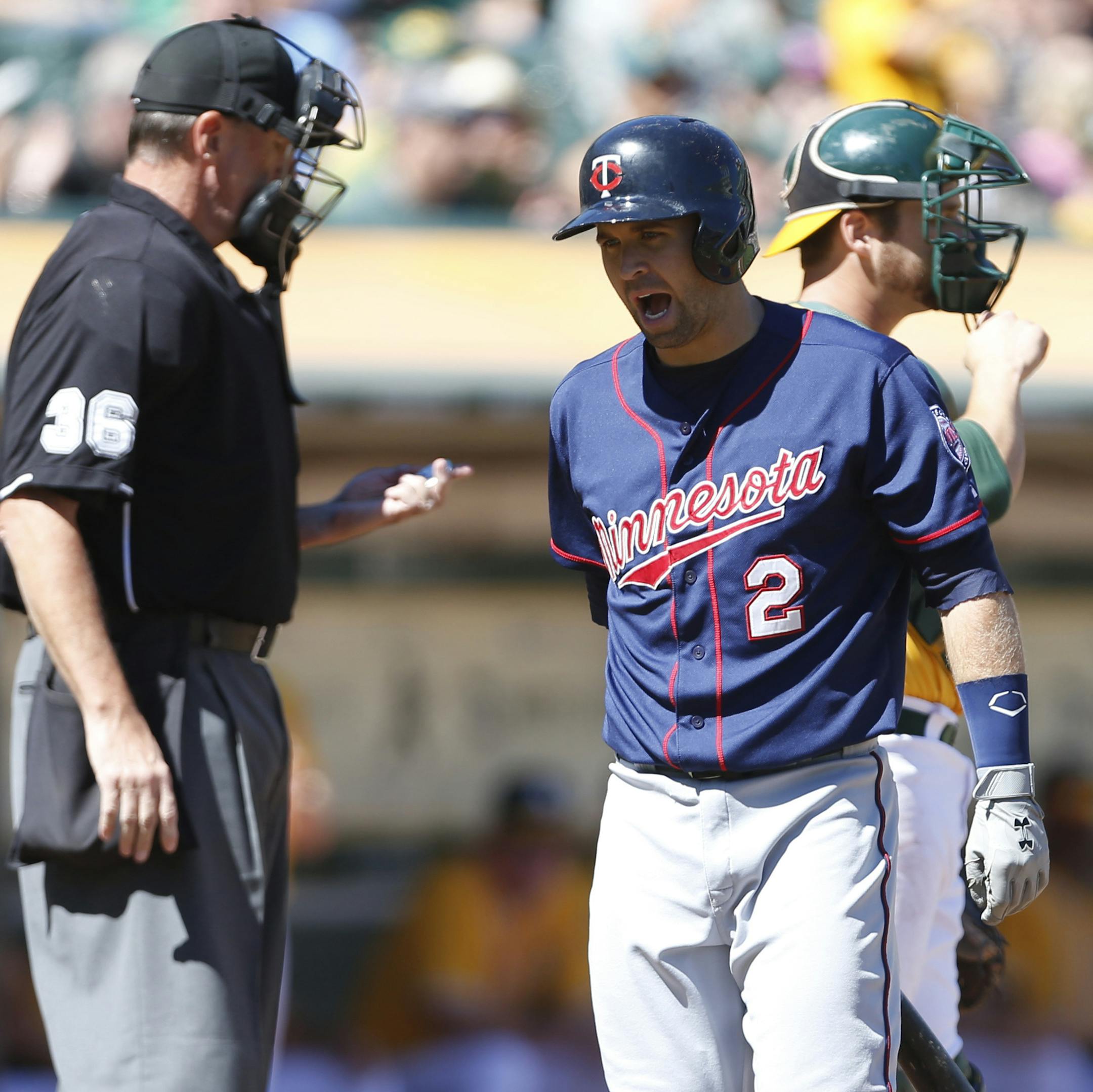 Minnesota Twins' Brian Dozier (2) reacts after striking out in the first inning of a baseball game against the Oakland Athletics, Sunday, Sept. 22, 2013, in Oakland, Calif. (AP Photo/Beck Diefenbach)