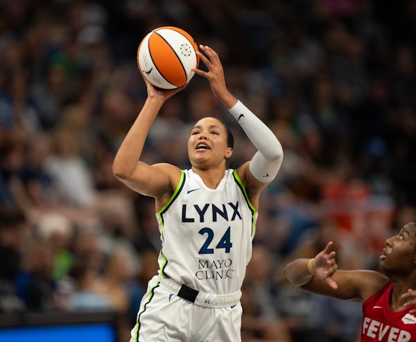Minnesota Lynx forward Napheesa Collier (24) shot while defended by Indiana Fever forward Aliyah Boston (7) in the third quarter. She led all scorers 