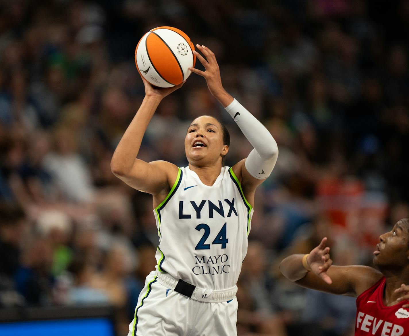 Minnesota Lynx forward Napheesa Collier (24) shot while defended by Indiana Fever forward Aliyah Boston (7) in the third quarter. She led all scorers with 32 points. The Minnesota Lynx defeated the Indiana Fever 90-83 in a WNBA basketball game Wednesday night, July 5, 2023 at Target Center in Minneapolis. ] JEFF WHEELER • jeff.wheeler@startribune.com