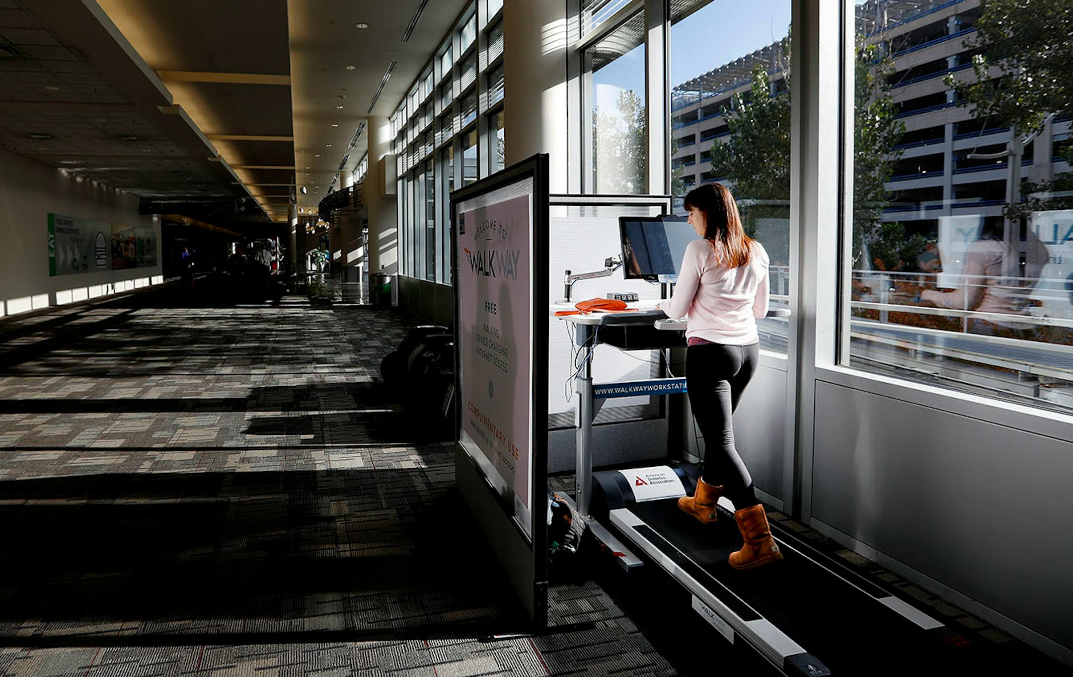 Kylie Naveau, 21, of Boise, ID used Walk Way a treadmill, desk and charging station in Concourse C during a 3 hour layover at the Minneapolis St. Paul International Airport.