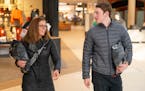 Julie Hansen and her son Elijah walked through Ridgedale Center with Christmas gifts purchased online to make an in-store return on Monday in Minneton