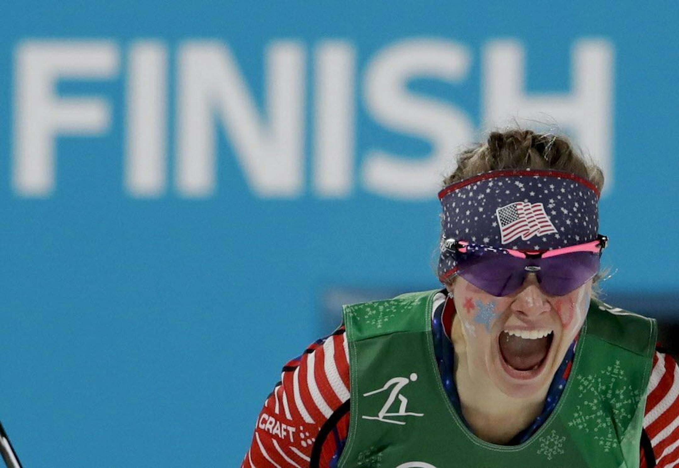 Jessie Diggins, of the United States, celebrates after winning the gold medal in the during women's team sprint freestyle cross-country skiing final at the 2018 Winter Olympics.