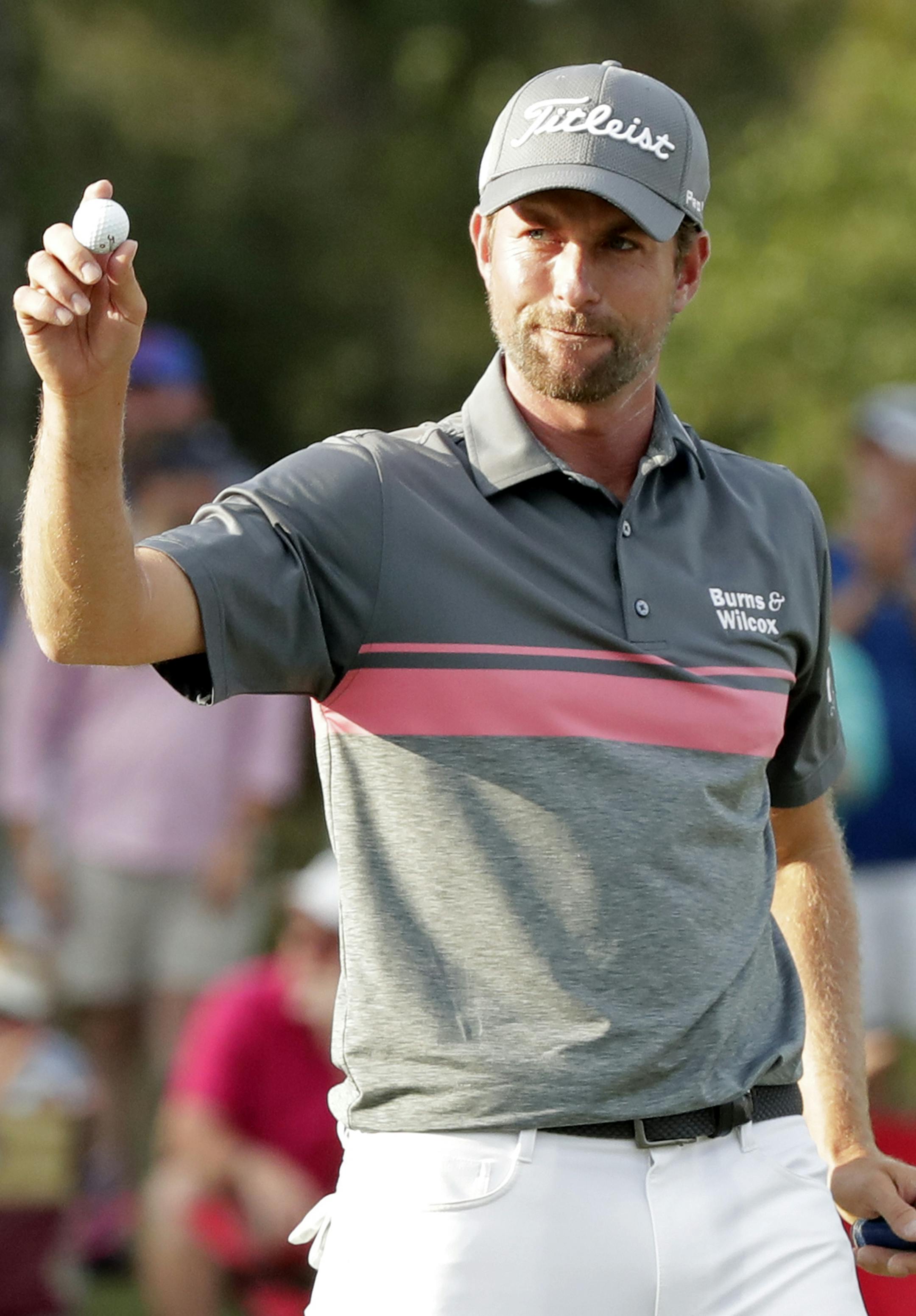 Webb Simpson gestures to fans after a birdie putt on the 17th green during the third round of the The Players Championship golf tournament Saturday, May 12, 2018, in Ponte Vedra Beach, Fla. (AP Photo/John Raoux)