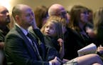 Brian Muller received comfort from his daughter EmmyLu as he bid farewell to his wife Amie Dahl Muller, 36, during her funeral services at Crossroads 