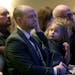 Brian Muller received comfort from his daughter EmmyLu as he bid farewell to his wife Amie Dahl Muller, 36, during her funeral services at Crossroads 