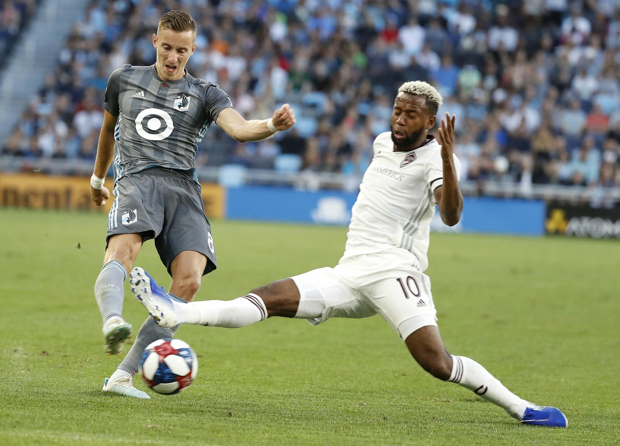 Minnesota United midfielder Jan Gregus (8) and Colorado Rapids midfielder Kellyn Acosta (10) battled during the first half.
