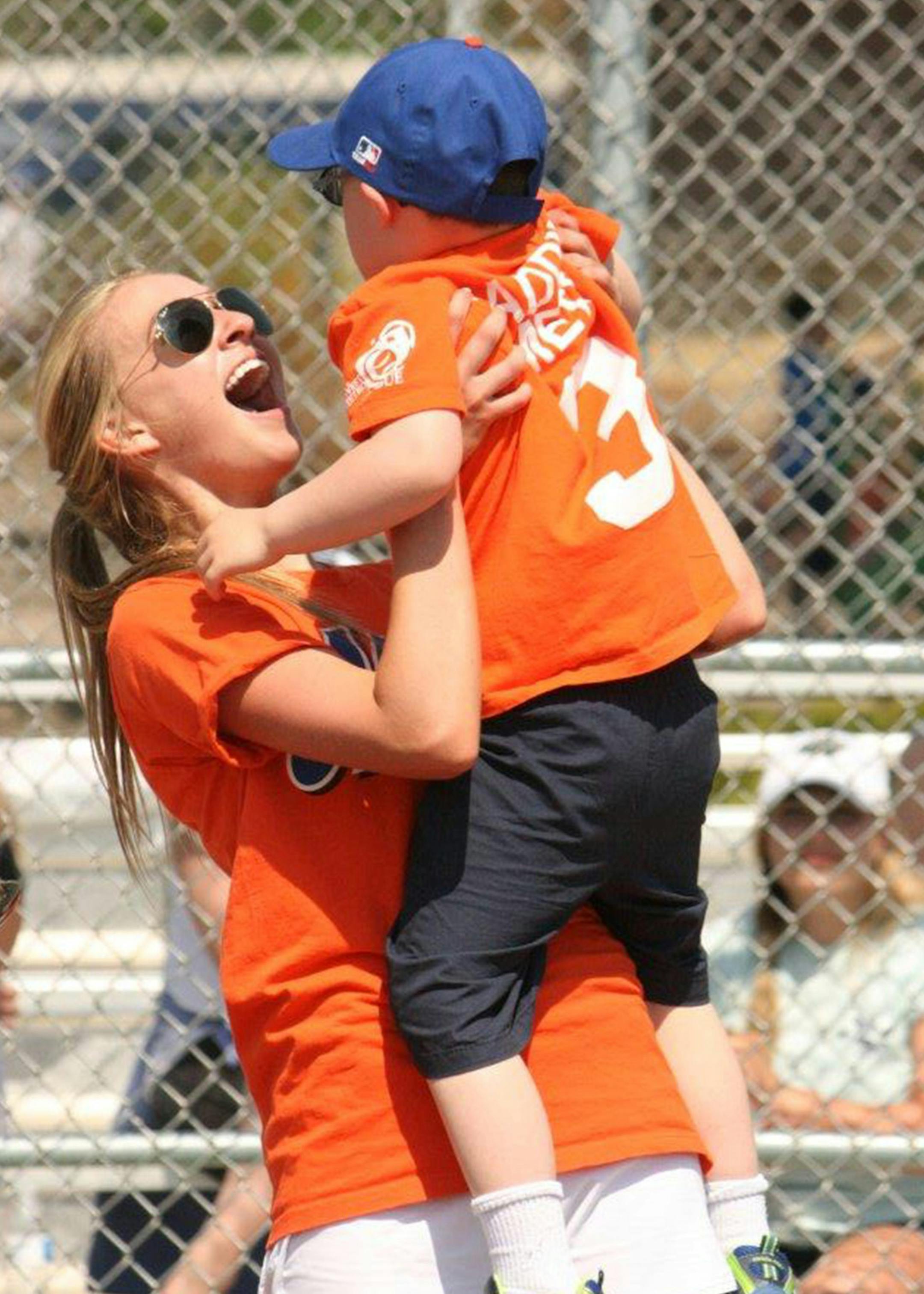 Minnetonka junior Maddie Hawley with one of the players. Photo by Jen Hawley