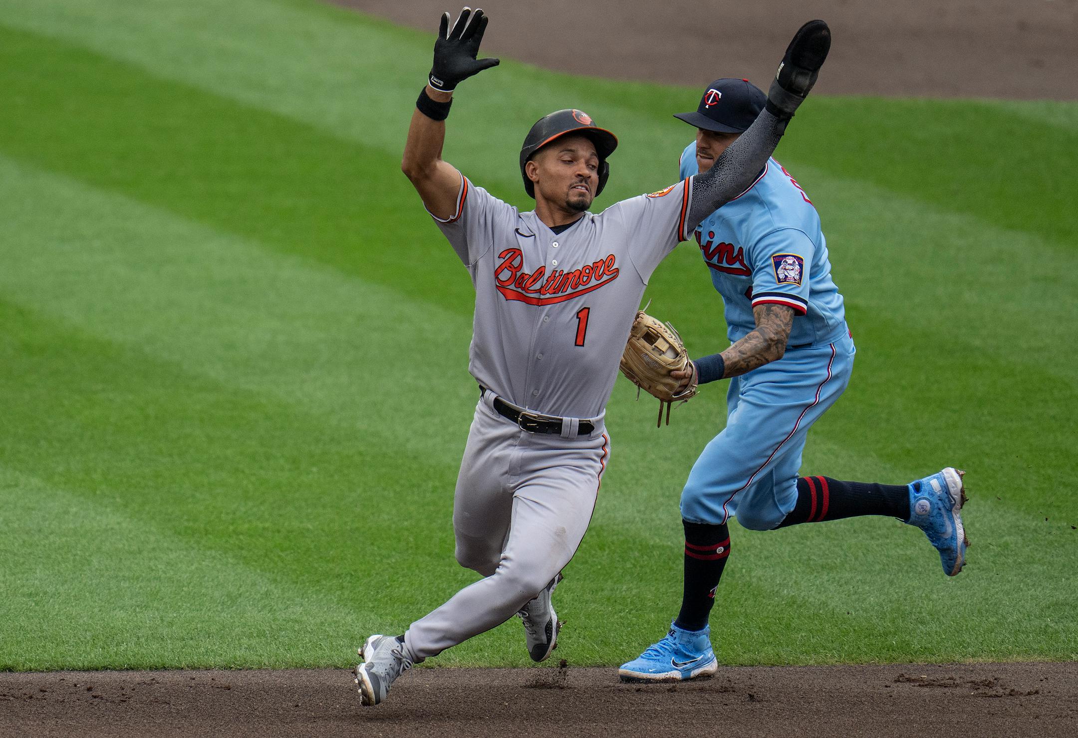 Baltimore Orioles second baseman Richie Martin (1) was tagged out by Minnesota Twins shortstop Carlos Correa (4) in the fifth inning.