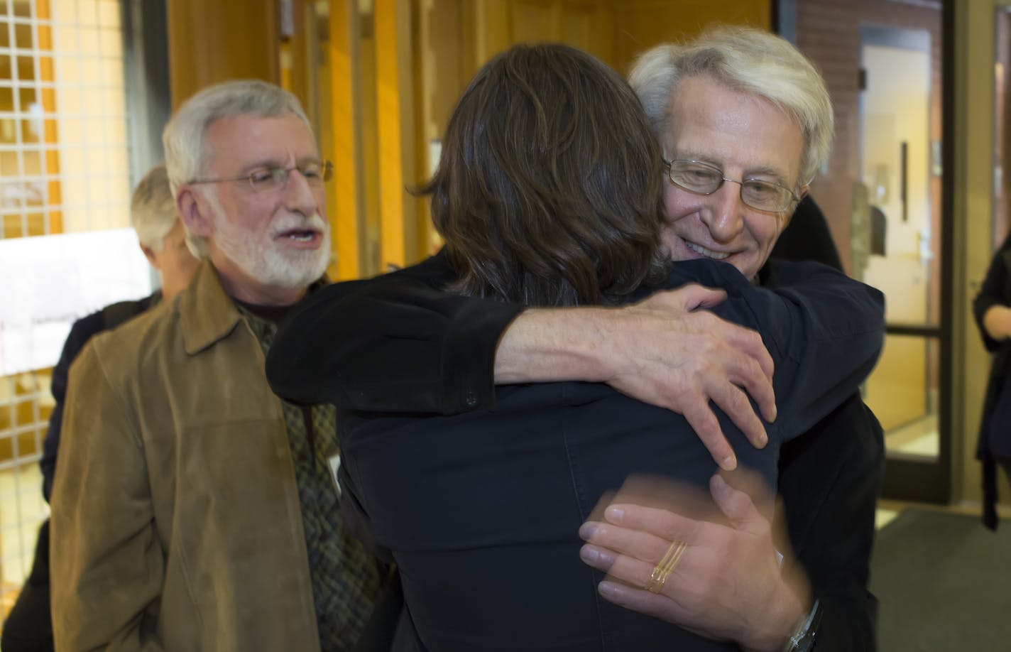 Decades ago, the University of Minnesota withdrew its job offer to Michael McConnell after he and Jack Baker became the first gay couple to apply for a marriage license in Minneapolis. On Monday the U of M celebrated the couple's donation of McConnell's historic files to the university. Here, Jack Baker (right) greets Eric Anderson at a reception Monday afternoon at the University of Minnesota. Michael McConnell (left) ] Brian.Peterson@startribune.com Minneapolis, MN - 10/26/2015