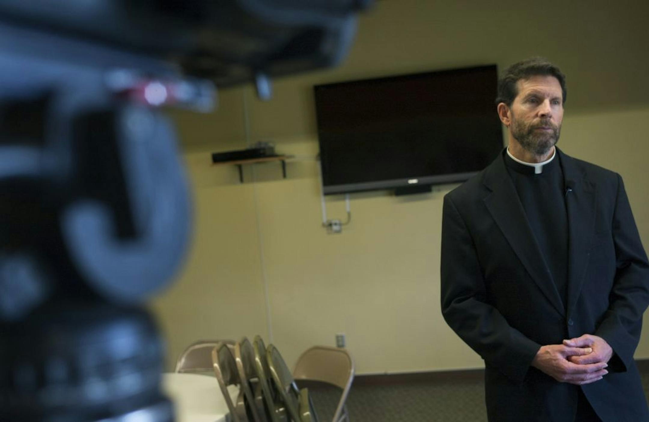 Victoria Parish Family Church pastor Bob White addressed the forced resignation of music director Jamie Moore, who married his gay partner. Moore decided Friday not to pursue legal action against Archbishop John Nienstedt, according to his former lawyer.