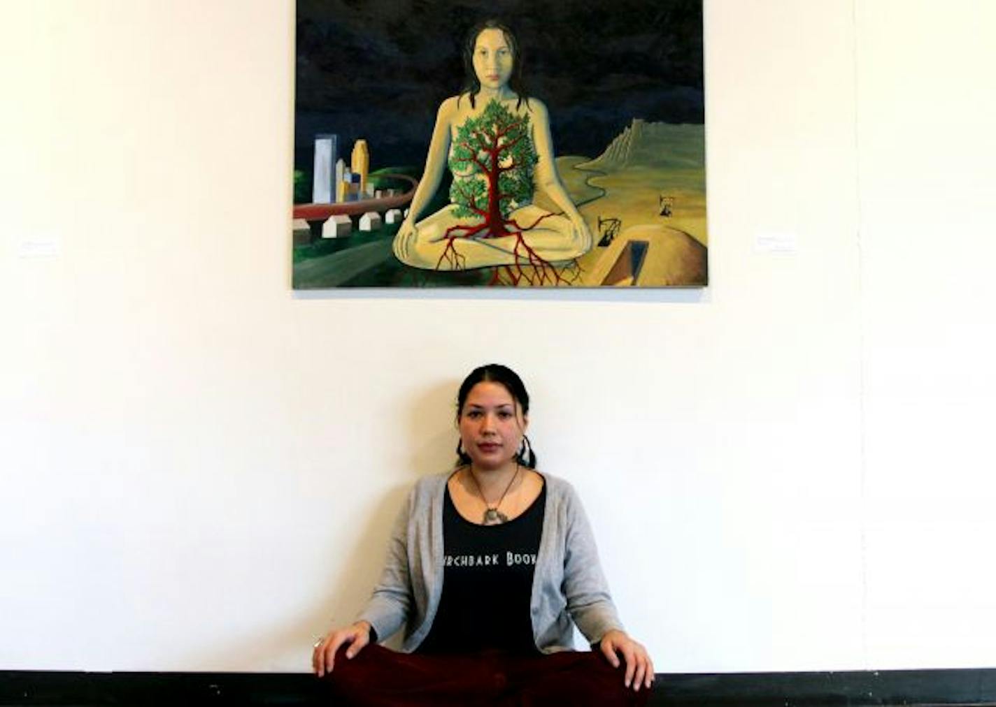 The Ancient Traders Gallery Show is showing 40 self portraits of Indians who have exhibited at the gallery since it opened 10 years ago. Exhibit curator and artist Carolyn Lee Anderson with her self portrait .