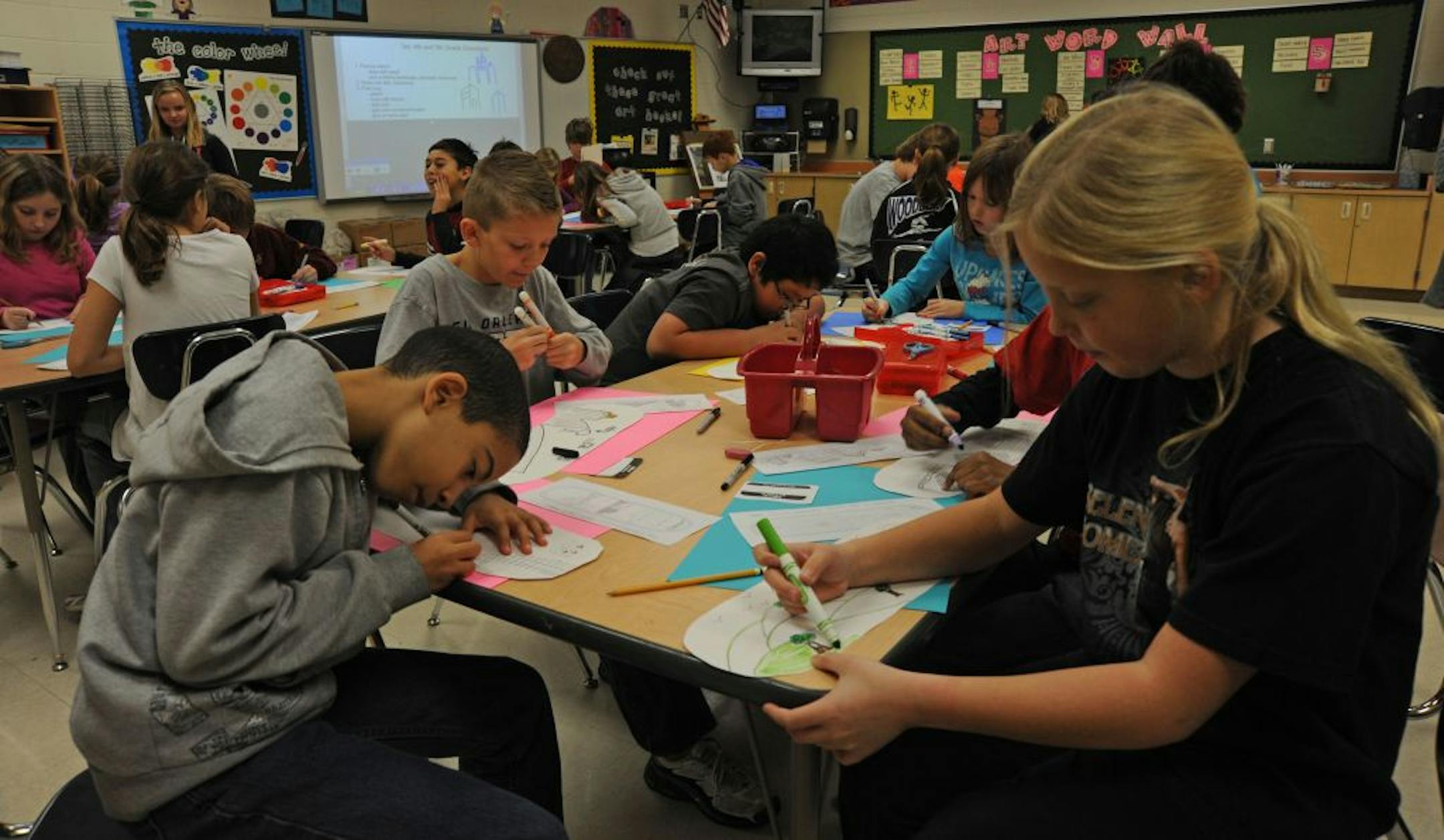 Liberty Ridge Elementary School can have classrooms with as many as 32 students because of overcrowding. In this art class students are crammed together drawing drawing elbow to elbow.