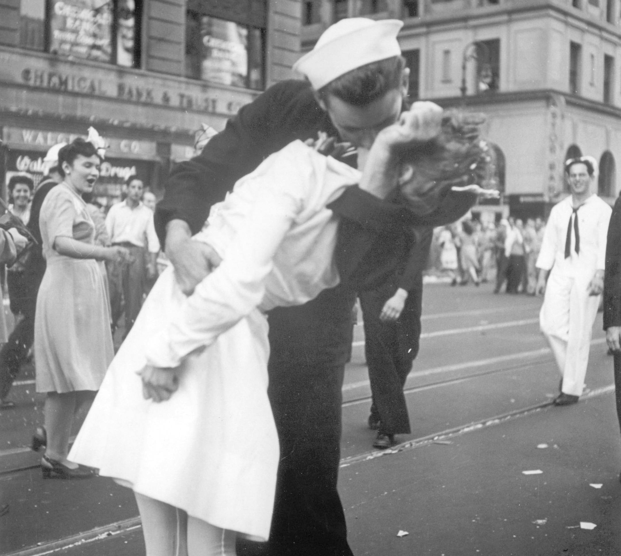 FILE - In this Aug. 14, 1945 file photo provided by the U.S. Navy, a sailor and a woman kiss in New York's Times Square, as people celebrate the end of World War II. The ecstatic sailor shown kissing a woman in Times Square celebrating the end of World War II has died. George Mendonsa was 95. It was years after the photo was taken that Mendonsa and Greta Zimmer Friedman, a dental assistant in a nurse’s uniform, were confirmed to be the couple. (Victor Jorgensen/U.S. Navy, File)