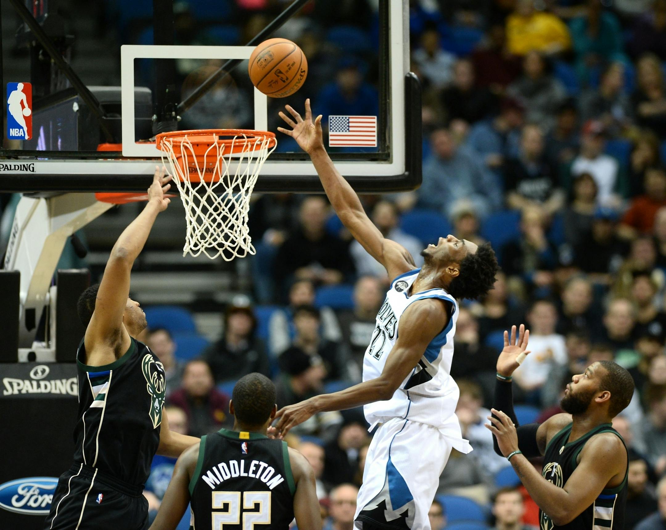 Minnesota Timberwolves guard Andrew Wiggins (22) was fouled by Milwaukee Bucks forward Jabari Parker (12) for an and-one in the fourth quarter of a game last season.