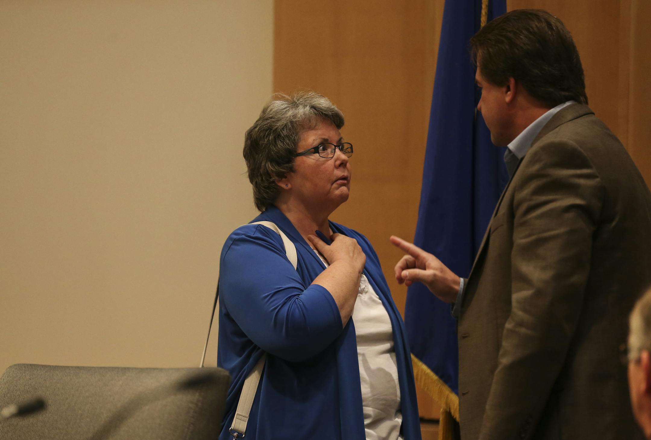 Council member Erik Johnson got into an argument with Council member LeAnn Sargent after a city council meeting when she wanted to talk to him about a previous bankruptcy he had had on a business soon after he publicly recommended she resign because of her fraud conviction on Monday, August 4, 2014, in Maple Grove, Minn. More than a dozen residents were at Monday's Maple Grove City Council meeting to protest council member LeAnn Sargent's return to the council. Despite being convicted of and ser