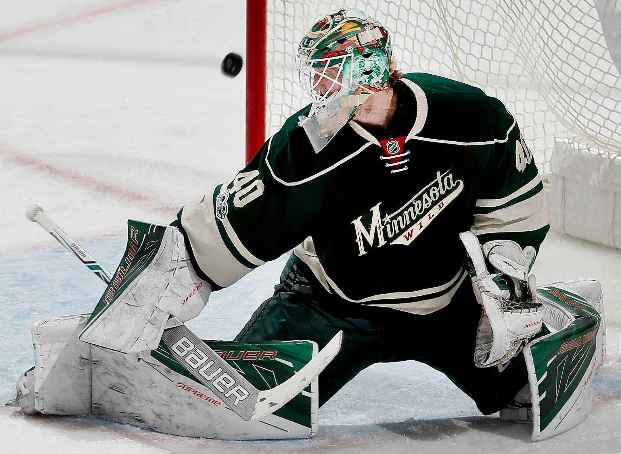 Wild goalie Devan Dubnyk made 30 saves, including this one in the third period, to beat the Colorado Avalanche 5-2 on Sunday.