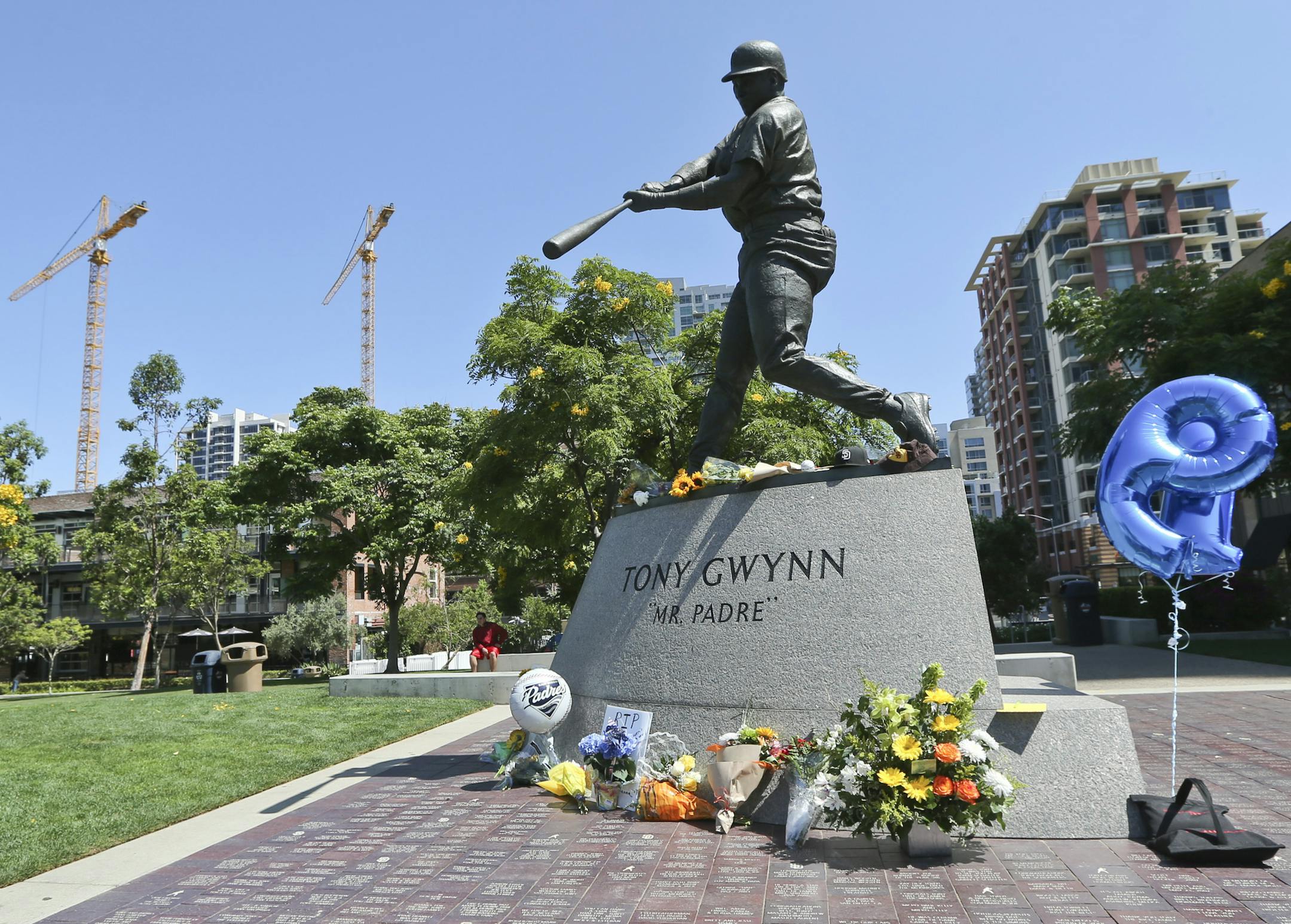Fans gave tribute to Tony Gwynn at his statue outside San Diego’s Petco Park on Monday.
