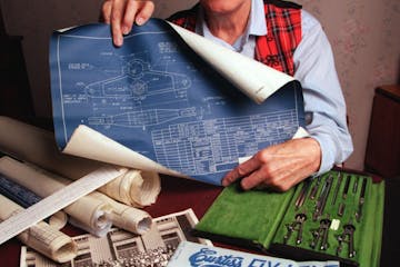 Loraine Plasman in 1995, at her home in Bloomington with some of the blueprints and drafting tools that she used as a Curtis-Wright “cadette” at t