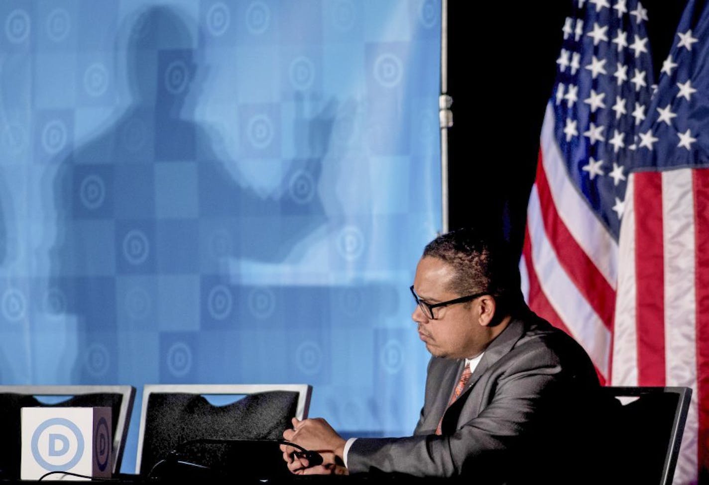 Rep. Keith Ellison, D-Minn, listens as newly elected Democratic National Committee Chairman Tom Perez gives a victory speech during the general session of the DNC winter meeting in Atlanta, Saturday, Feb. 25, 2017. Perez picked runner-up Ellison to be deputy chairman. (AP Photo/Branden Camp) ORG XMIT: MIN2017022616425712