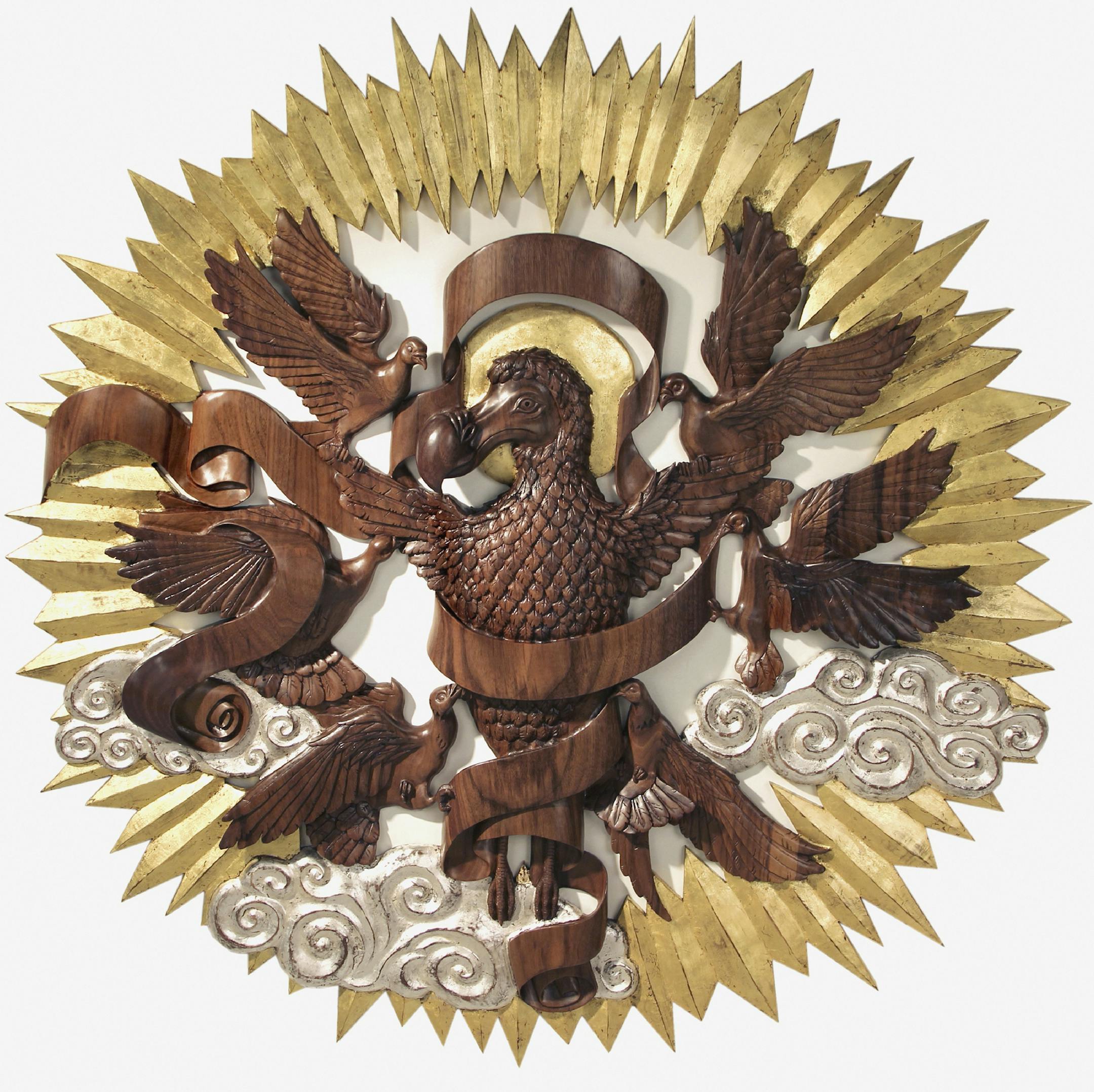 Laurel Roth Hope’s “Flight of the Dodo,” in walnut with gold and silver leaf (and “angel” pigeons), calls on traditional imagery to mourn extinct species.