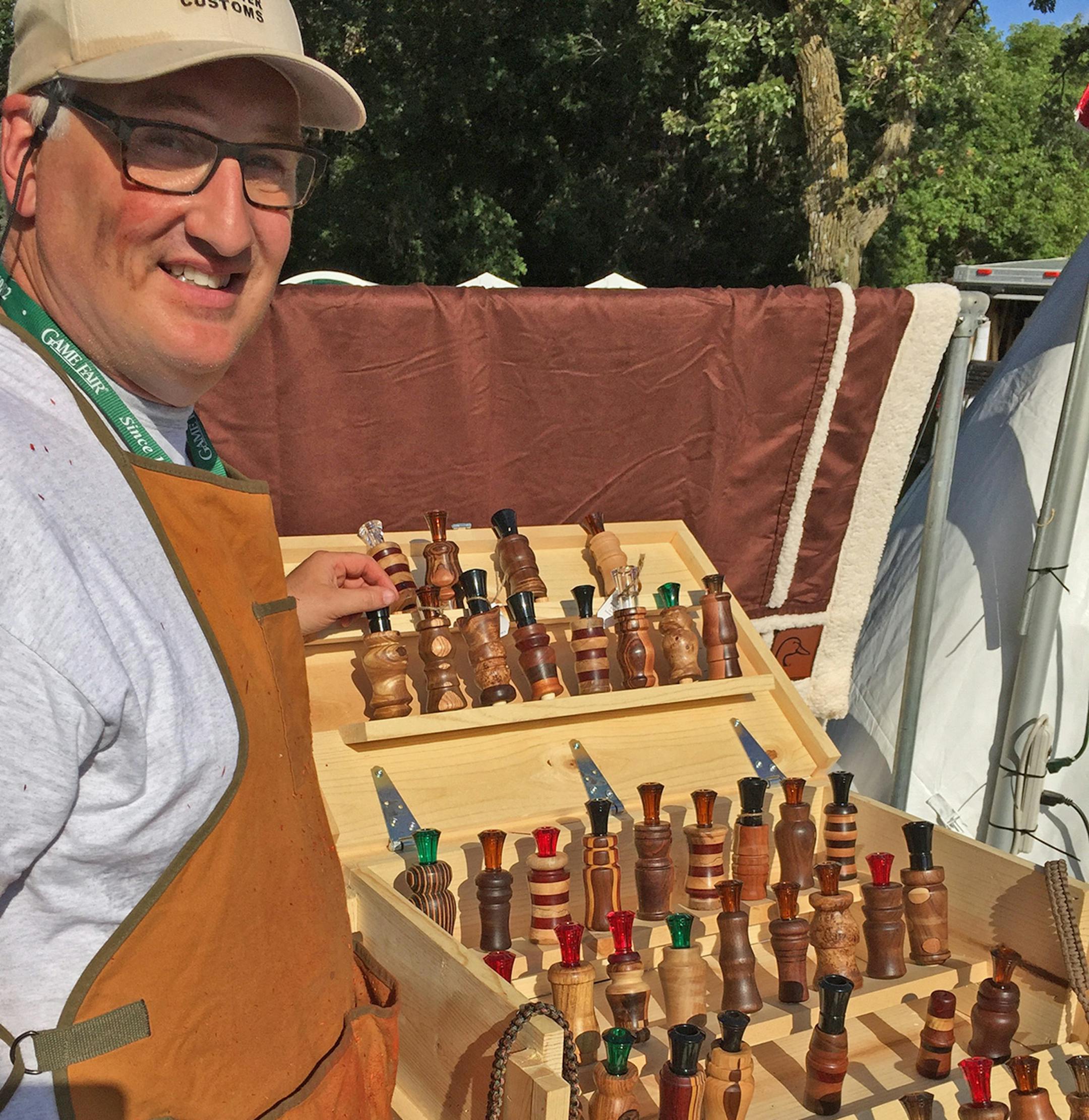 John Arms of Minneapolis with some of the handmade wooden duck and goose calls he markets under the name Backwater Customs (www.wearebackwater.com). Each call is made from recycled wood.