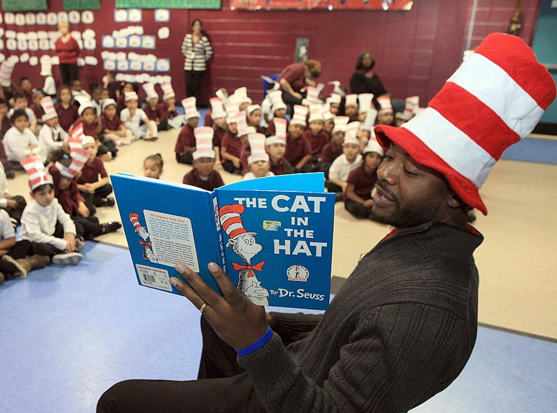 Eugene Croff, a second-grade teacher, reads for students before a surprise arrival by The Cat in the Hat at the South Main Street School, in Pleasantville, N.J., Thursday Feb. 28, 2013, as part of a Read Across America celebration. (AP Photo/The Press of Atlantic City, Vernon Ogrodnek) MANDATORY CREDIT