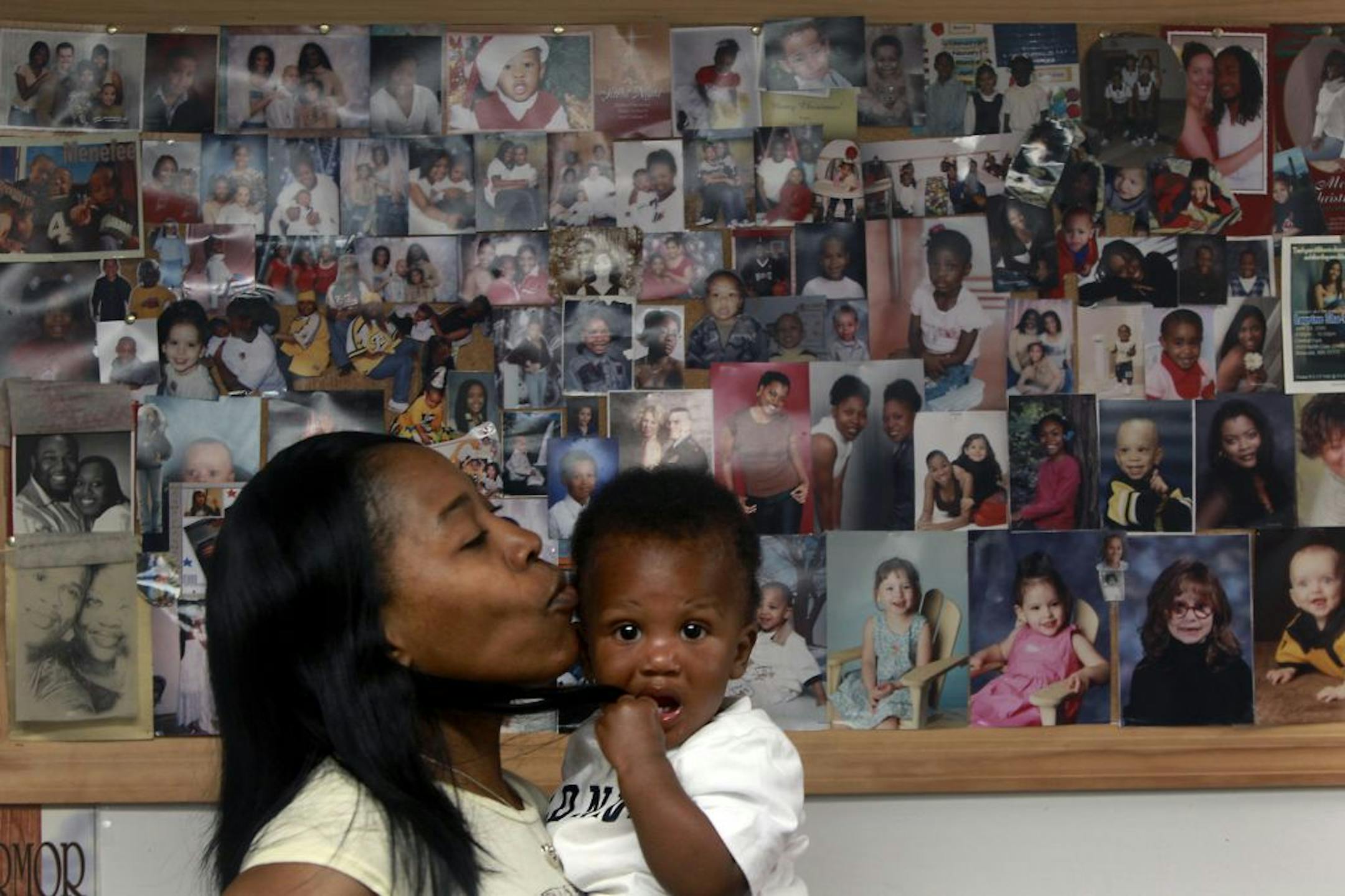 Roxanne Williams gave Isaiah Scott a kiss as she got him and the rest of her kids ready for a field trip.