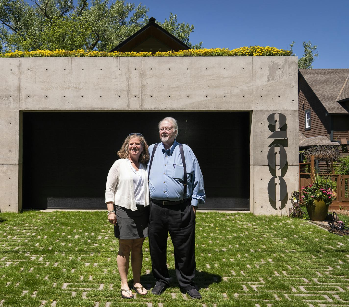 Homeowners Pat Matre, right, and Miriam Goldfein pose for a photo on their grow-through paver driveway. ] LEILA NAVIDI &#x2022; leila.navidi@startribune.com BACKGROUND INFORMATION: AIA Home of the Month, a net zero home in Excelsior photographed on Thursday, June 13, 2019.