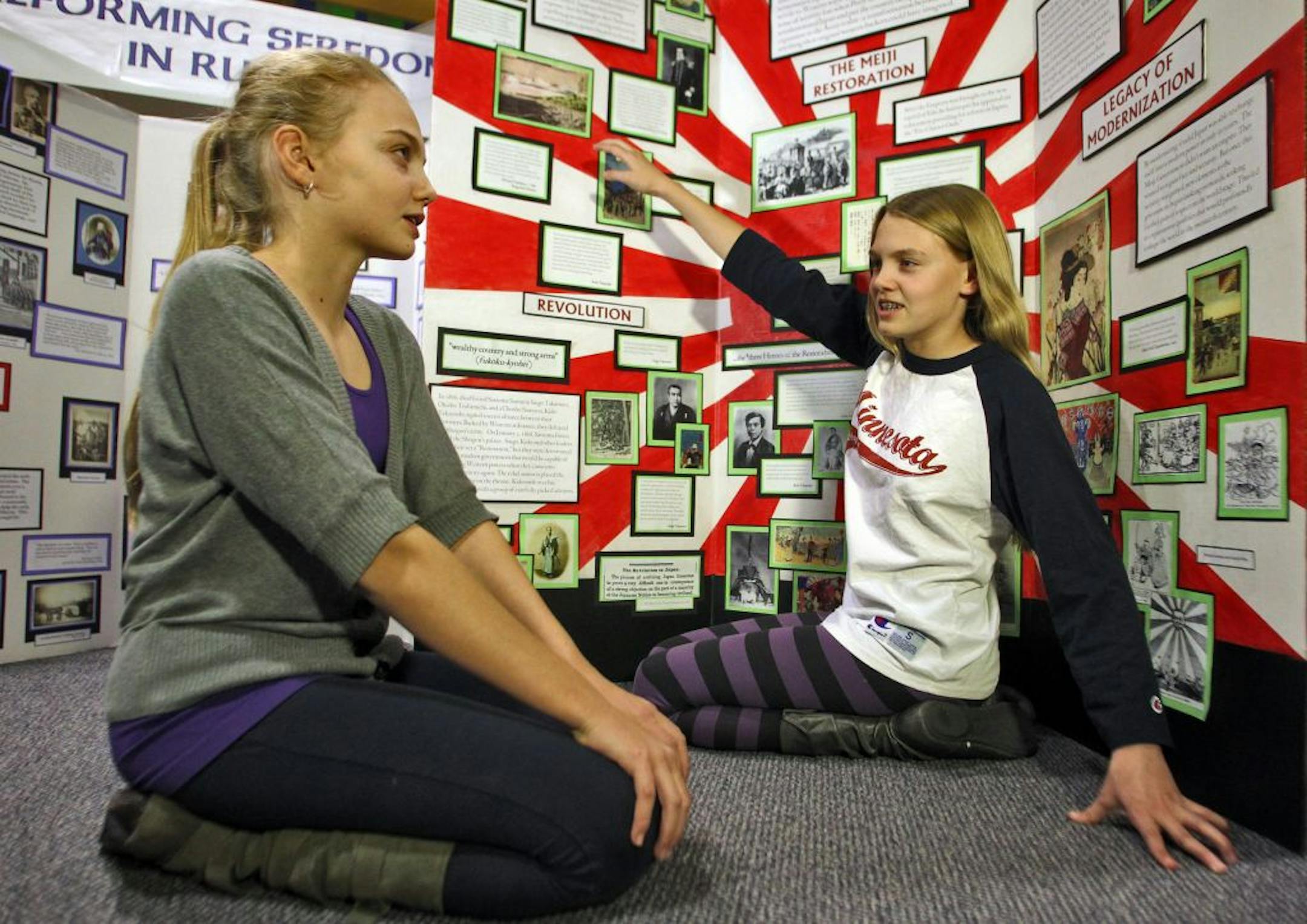 Sovigne, left, and Grace Gardner, 12-year-old twins from St. Paul, discussed their award-winning projects at the Minnesota History Center in St. Paul.
