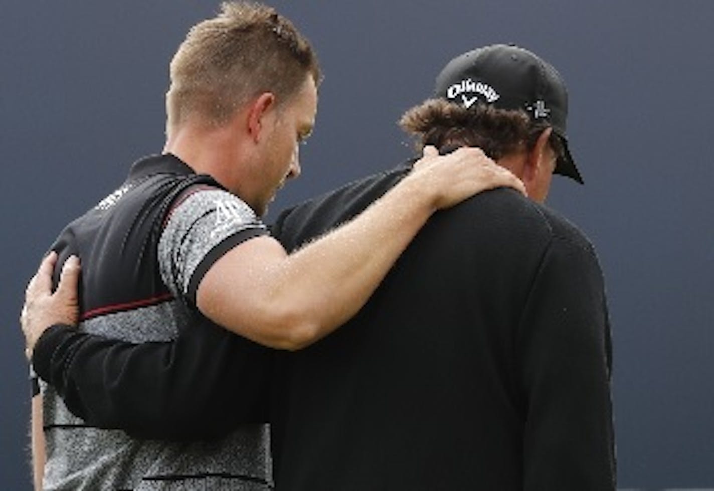 Henrik Stenson of Sweden, left, and Phil Mickelson of the United States embraced as they walked off the 18th green after Stenson won the British Open at Royal Troon on Sunday.