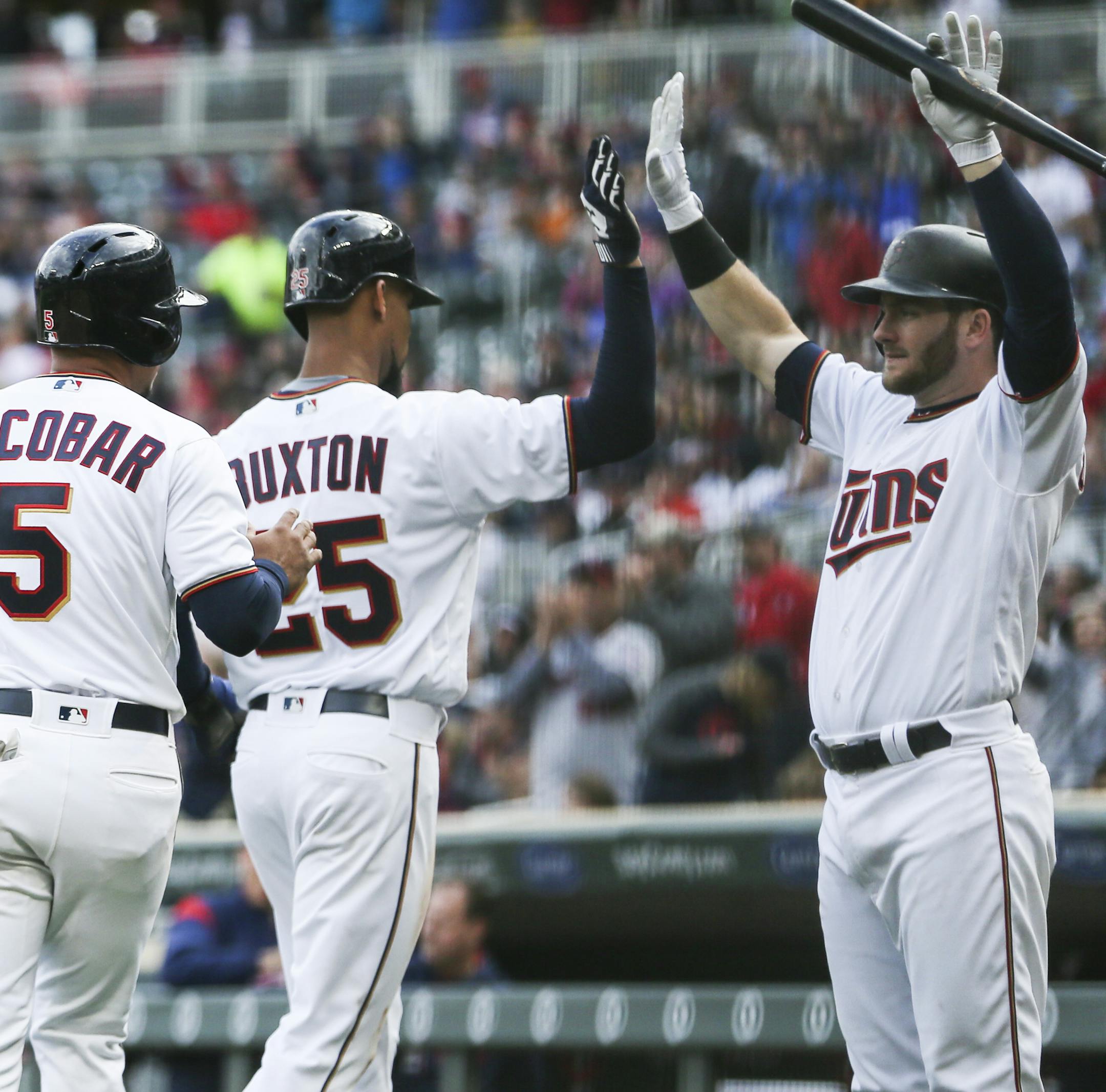 Minnesota Twins third baseman Eduardo Escobar (5) and Minnesota Twins center fielder Byron Buxton (25) celebrated with Minnesota Twins designated hitter Robbie Grossman (36) (at right) at home plate after scoring on a single by Minnesota Twins catcher Jason Castro (21) in the fourth inning. ] RENEE JONES SCHNEIDER • renee.jones@startribune.com The Minnesota Twins verses Detroit Tigers on October 1, 2017, at Target Field in Minneapolis, Minn.