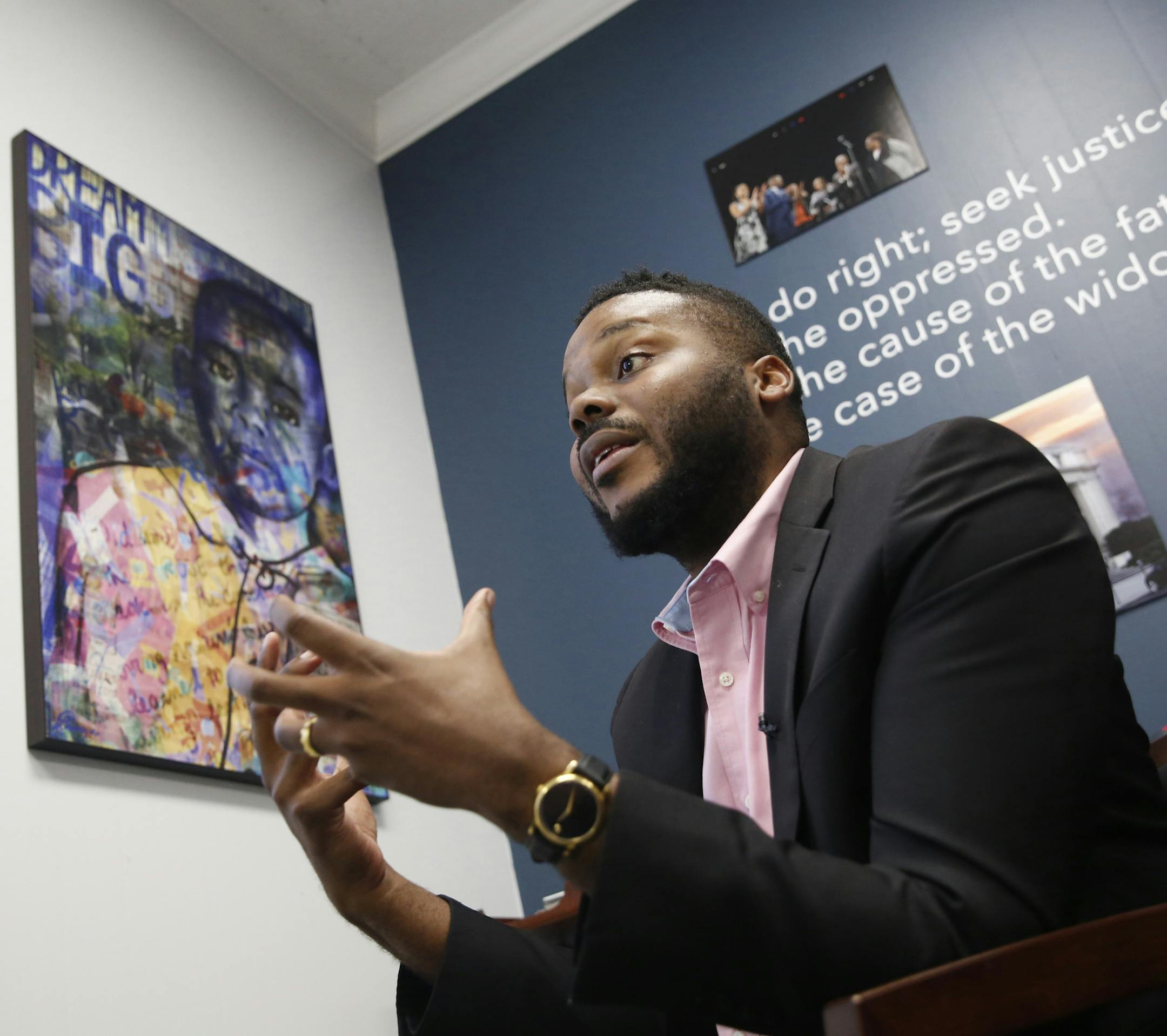 FILE -- In this Wednesday Aug. 14, 2019 file photo Stockton Mayor Michael Tubbs discusses a program he initiated to give $500 to 125 people who earn at or below the city's median household income of $46,033 during an interview in Stockton, Calif. After eight months new data shows people have spent 70 percent of that money on things like food, clothing and utility bills. Tubbs hopes the new data will win over skeptics. (AP Photo/Rich Pedroncelli, File)