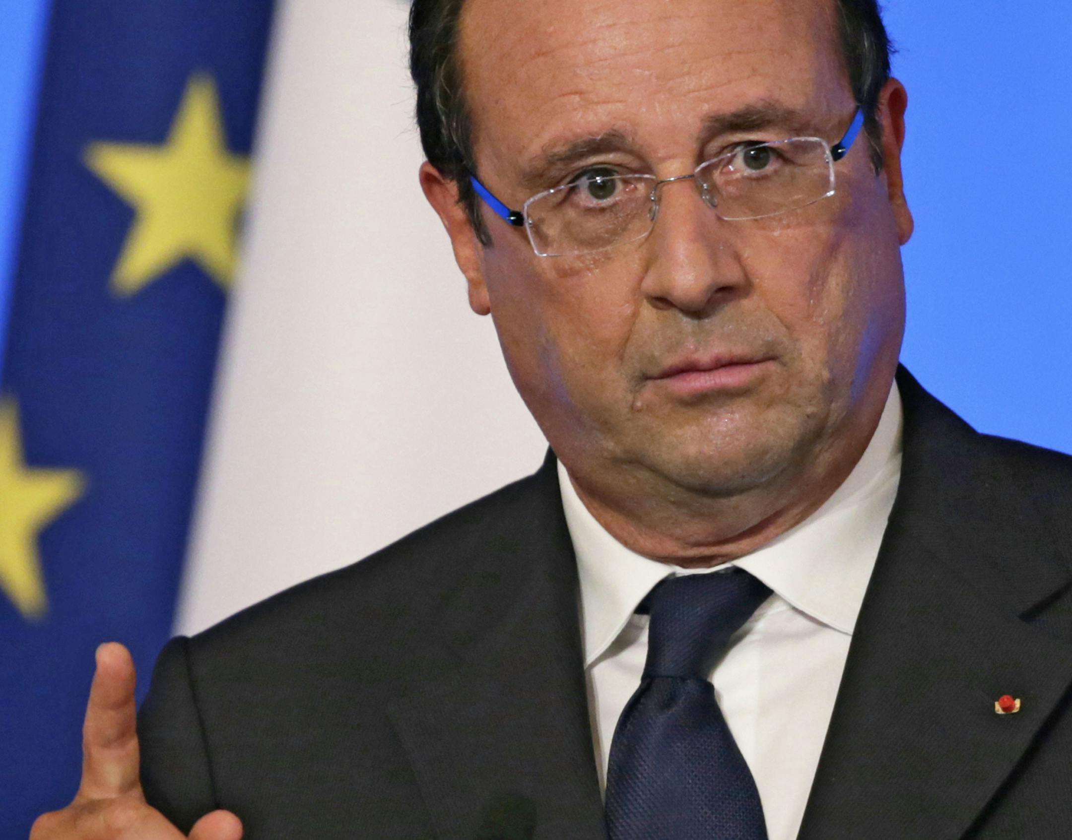 French President Francois Hollande delivers his speech during a conference with France's ambassadors, at the Elysee Palace, in Paris, Tuesday Aug. 27, 2013. Francois Hollande said France is prepared to take action against those responsible for gassing people in Syria.(AP Photo/Kenzo Tribouillard/Pool) ORG XMIT: MIN2013082719525186