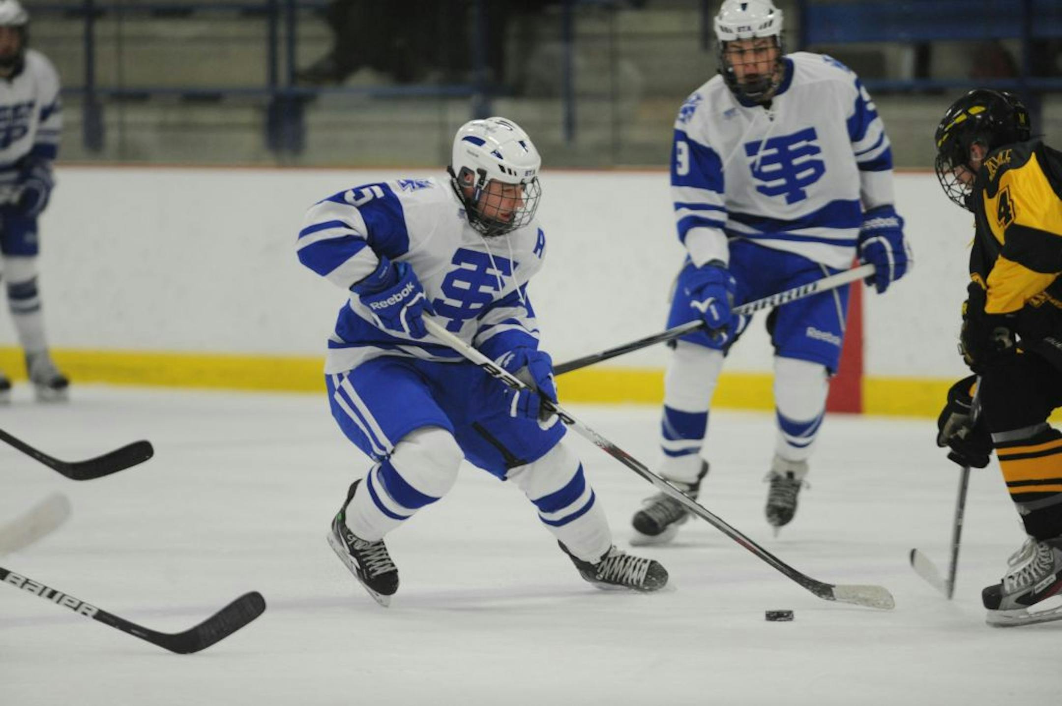 Eric Schurhamer handled the puck earlier this month in a game against Duluth Marshall. Photo courtesy Pete Bretzman