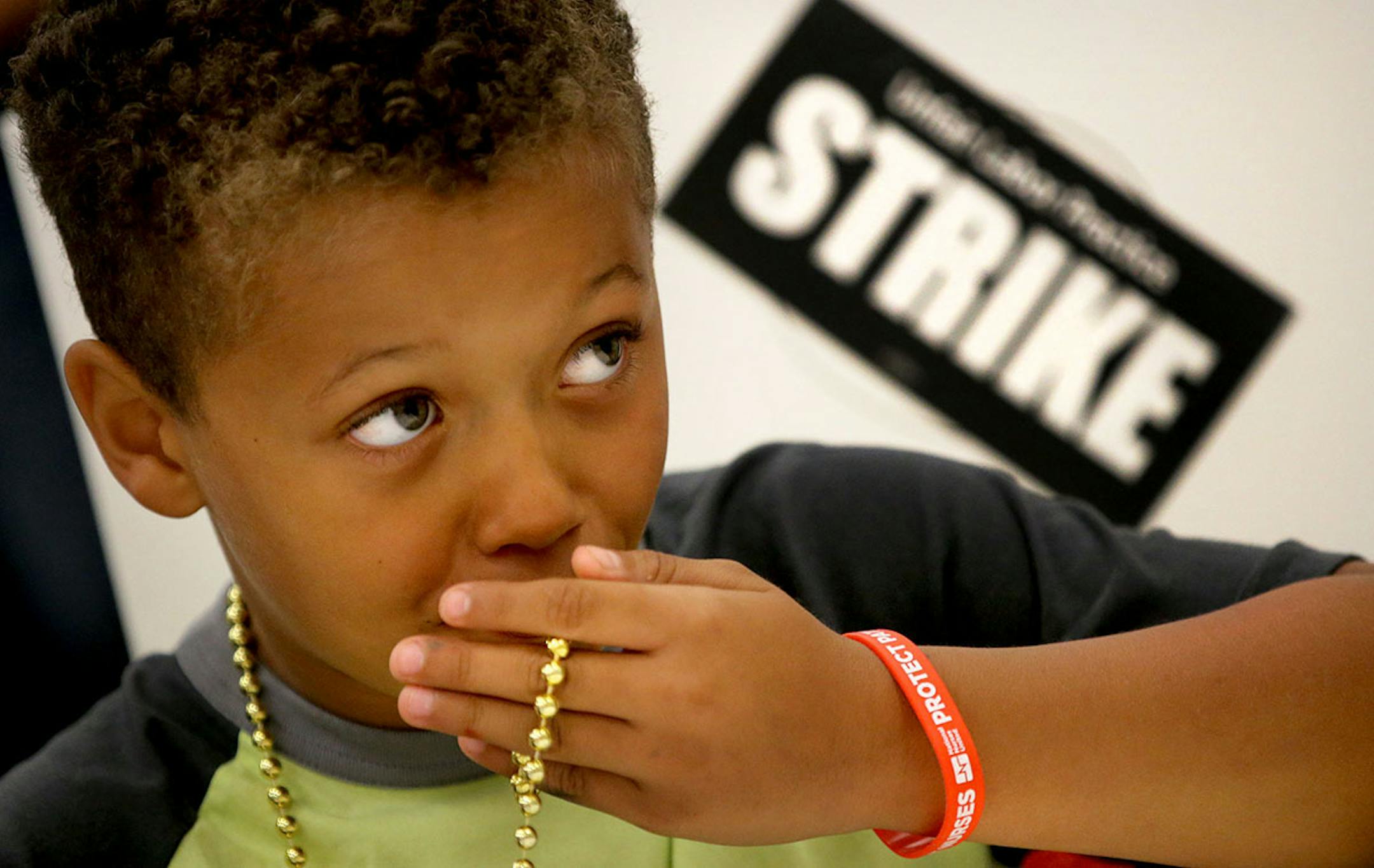Mark Mathis, 7, of St. Paul, helped his uncle Michael Ciampi, who is an RN at United Hospital in St. Paul as they joined MNA nurses, Minnesota Nurses Association employees and family members at the MNA headquarters to make posters for picketing Saturday, June 18, 2016, should a strike happen Sunday at five Twin Cities Allina Health facilities.