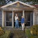 Tim Foster, holding 14-year-old Papillon Vince, and Bruce Schabell, in front of a Romanesque garden temple with a screen porch on March 6, 2024 that t