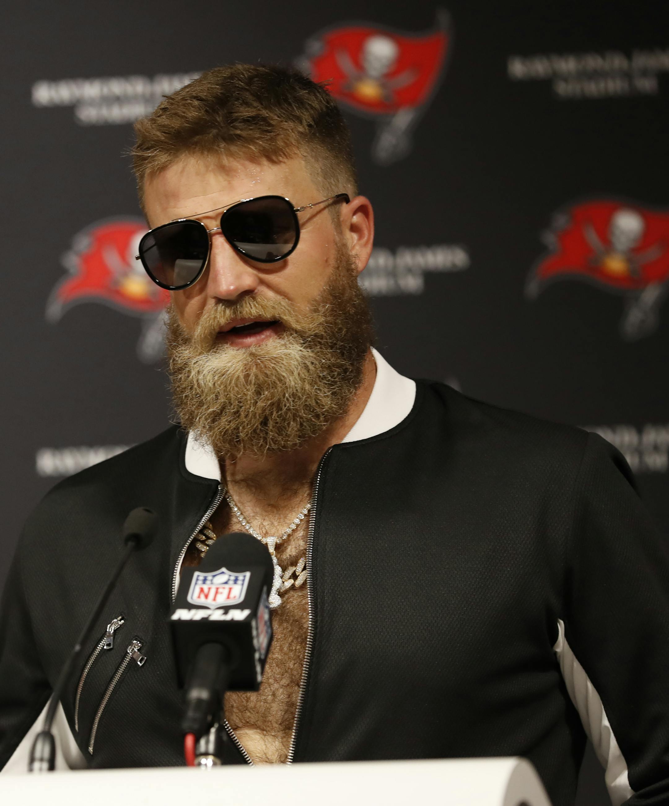 Tampa Bay Buccaneers quarterback Ryan Fitzpatrick (14) talks during a post game news conference following an NFL football game against the Philadelphia Eagles, Sunday, Sept. 16, 2018, in Tampa, Fla. The Buccaneers defeated the Eagles 27- 21. (AP Photo/Mark LoMoglio)