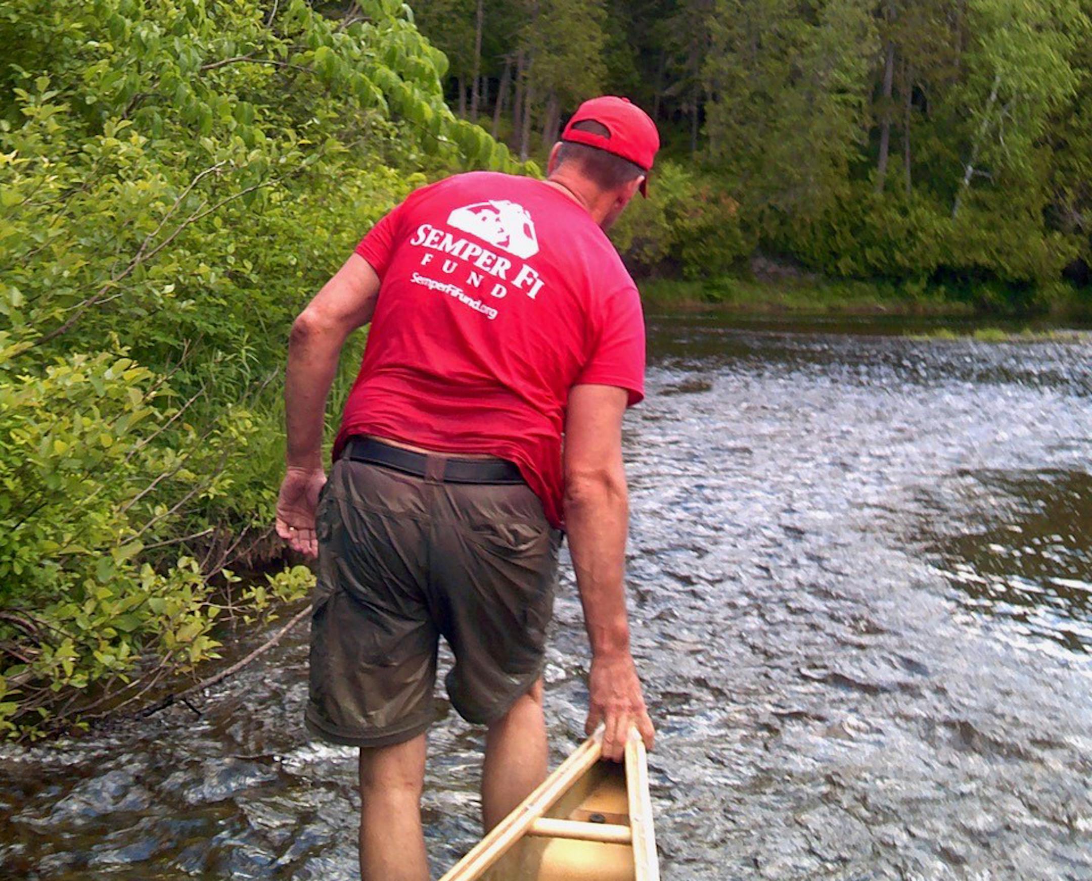 Joe Banavige pulled his canoe upriver on the Aroostook in Maine as part of his retracing of Theodore Roosevelt.