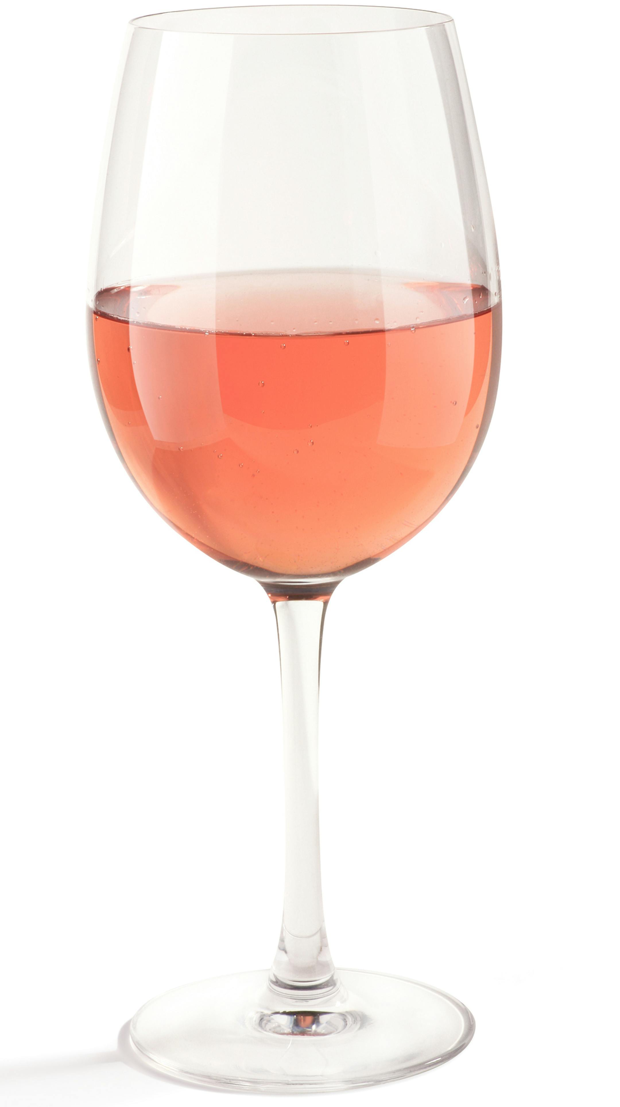 A single glass of pink wine in a large stemware on a white background