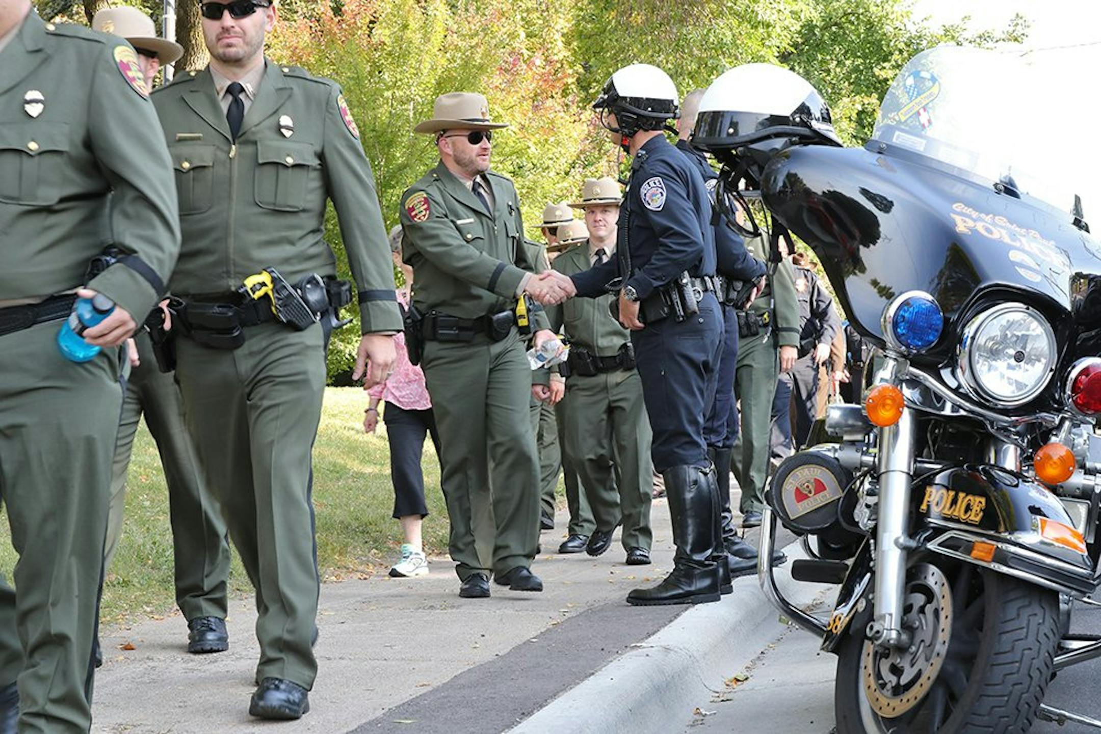 Law enforcement began to assemble before the funeral of Wayzata officer William Mathews Thursday, Sept. 14, 2017.