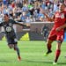 Minnesota United midfielder Miguel Ibarra, left, celebrates his first-half goal against Toronto FC on Wednesday, July 4, 2018, at TCF Bank Stadium in 