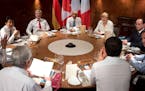 Left to right clockwise, European Council President Donald Tusk, Japanese Prime Minister Shinzo Abe, Canadian Prime Minister Stephen Harper, US Presid