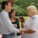 Alongside his wife Mary, Gov. Tim Pawlenty, R-Minn., is greeted by New Hampshire State Rep. Julie Brown, R-Rochester, at the GOP picnic in Dover, N.H.