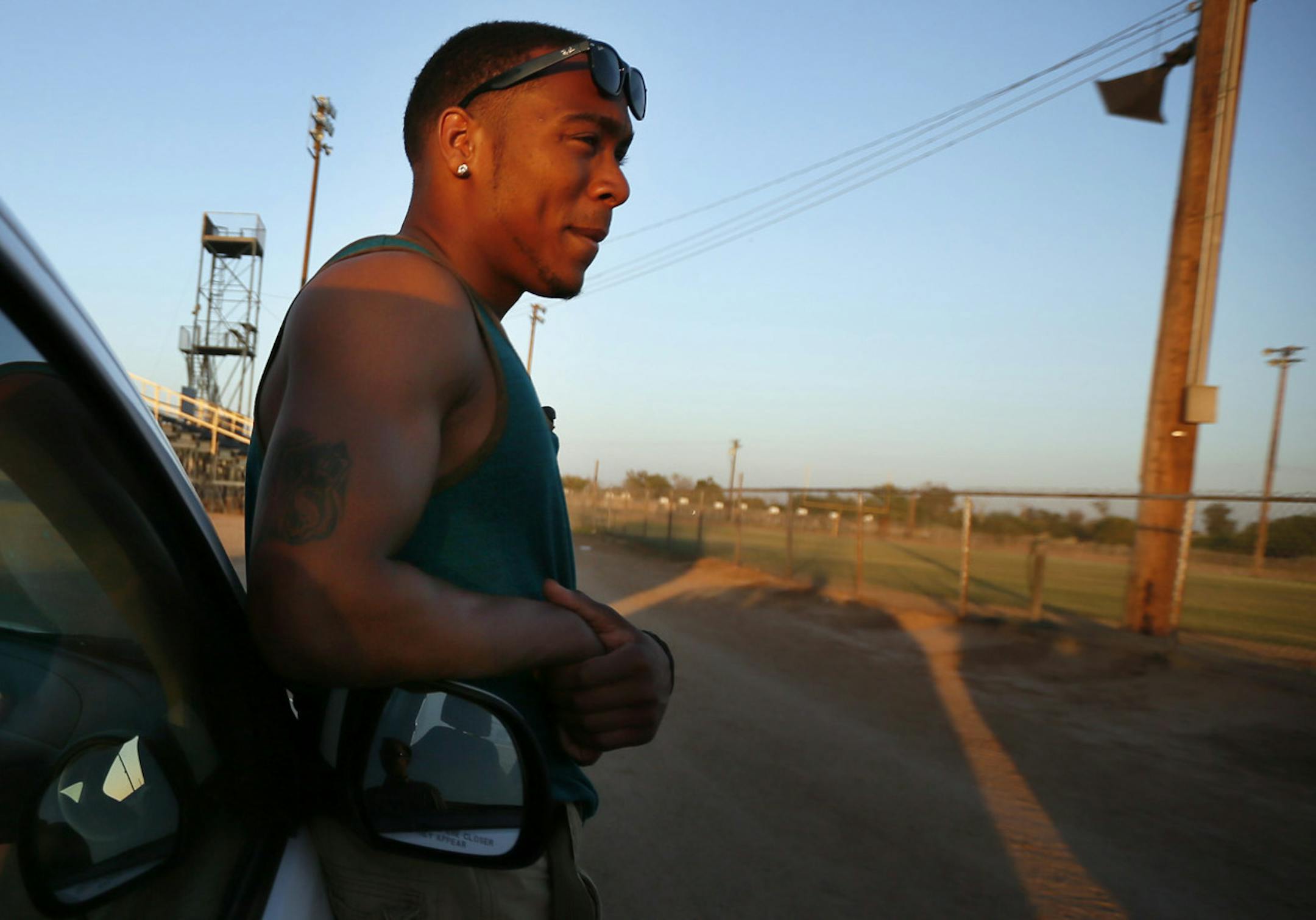 Cedric Thompson stood near the football field at Calipatria High school on a recent trip . Thompson grew up in Compton. His freshman year at Piedmont High School, three people close to him (a cousin and two friends) were killed in gang shootings. His parents divorced, and his mother urged him to get out of L.A., and move with his dad in Bombay Beach, a forgotten outpost on the Salton Sea. CA] JERRY HOLT ‚Ä¢ jerry.holt@startribune.com