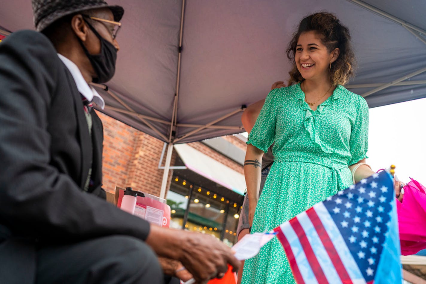 Sheila Nezhad (Minneapolis mayoral candidate), right, speaks with Avdi Barre, left, during a Somali Independence Day Festival on Franklin Avenue on Saturday, June 26, 2021, in Minneapolis. Nezhad has been a community organizer for over a decade. ] ANTRANIK TAVITIAN • anto.tavitian@startribune.com